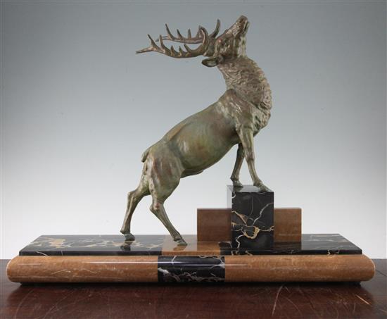 A French Art Deco patinated metal figure of a stag, 25in.